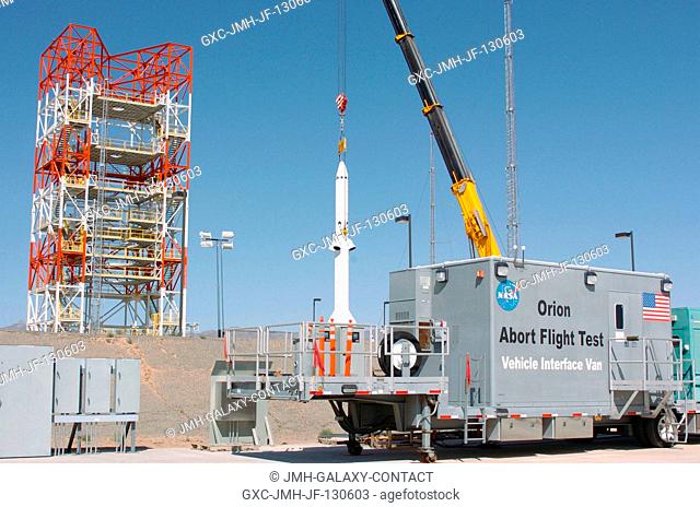 The launch abort system for the Pad Abort-1 (PA-1) flight test is stacked on top of the boilerplate crew module at the launch pad in preparation for the test at...