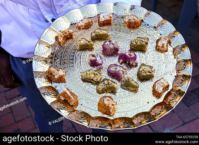 CYPRUS, NICOSIA - DECEMBER 14, 2023: A tray holds sweets for tasting at the Old Market. The Turkish Republic of Northern Cyprus is a de facto state declared...