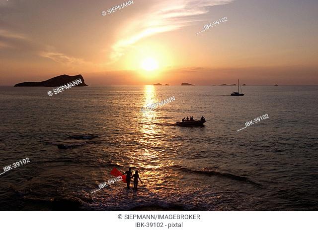 Sunset in Cala Comte near Sant Josep with view to the island S' Espartar