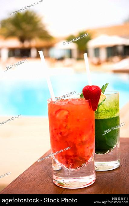 Cocktails near the swimming pool red and green