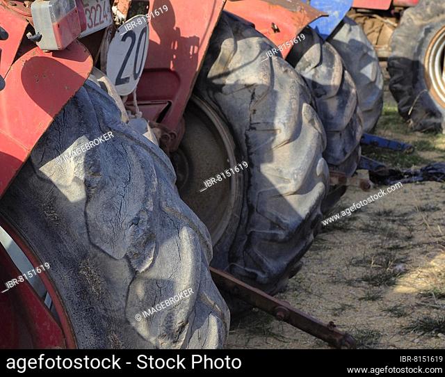 Tyres of several tractors, tractors on scrap yard, metal recycling, recycling of scrap metal, metal recycling, sustainability, detailed view, scrap car