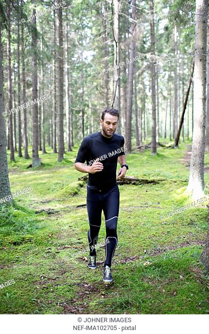 Man running in forest