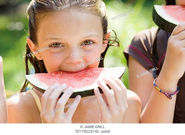 Girls eating watermelon