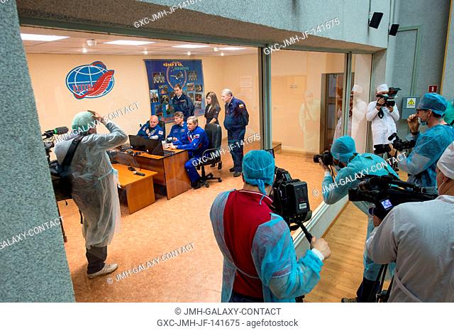 Various Media document Expedition 43 NASA Astronaut Scott Kelly, seated left, Russian Cosmonauts Gennady Padalka, center
