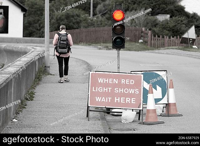 Emergency traffic light with sign at a road in Scotland