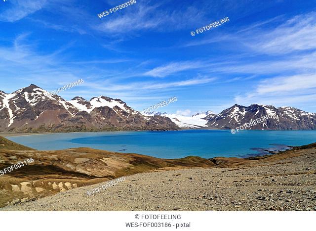 South Atlantic Ocean, United Kingdom, British Overseas Territories, South Georgia, Whistle Cove, Fortuna Bay, View of mountains with ocean