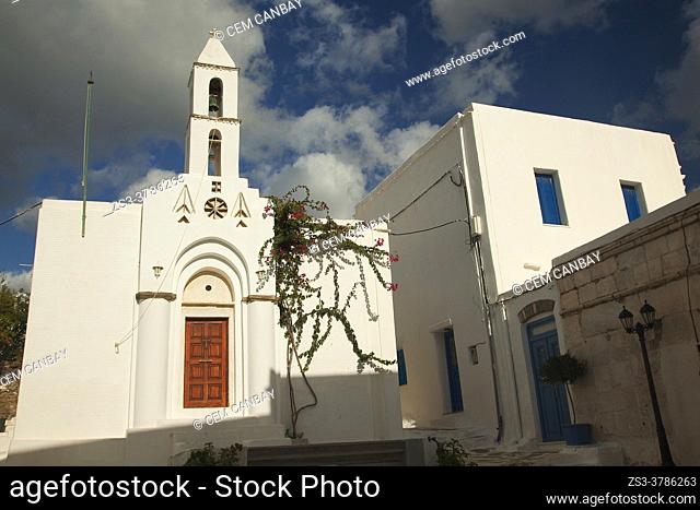 View to the traditional whitewashed houses and a small church near the old town Chora-Hora, Tinos Island, Cyclades Islands, Greek Islands, Greece, Europe