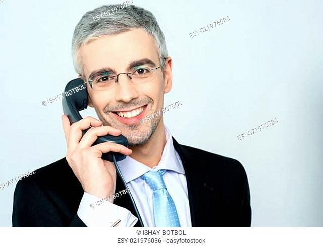 Businessman attending phone call