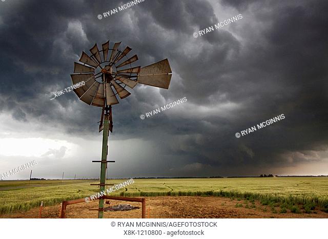 An old-fashioned windmill set against the roiling clouds of a severe thunderstorm in northern Oklahoma, May 12, 2010