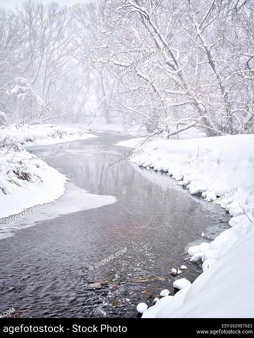 heavy snowstorm over Poudre River in northern Colorado, one of natural areas in Fort Collins