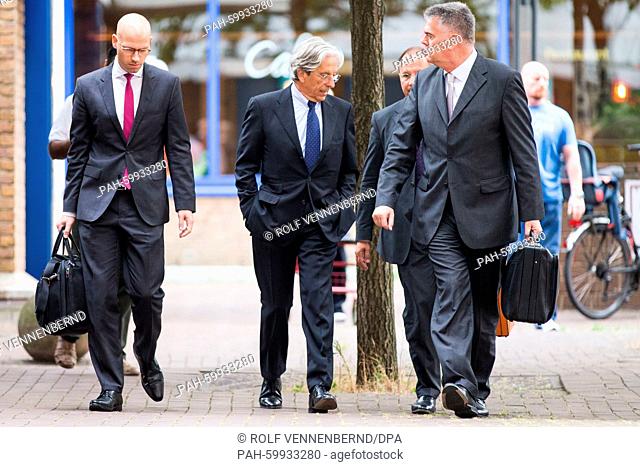 Former banker Dieter Pfundt (2-L) arrives to the district court in Cologne, Germany, 09 July 2015. All four defendants were sentenced to imprisonment in the...