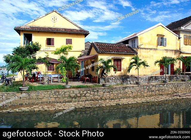 French colonial buildings on the canel in Hoi An, Vietnam