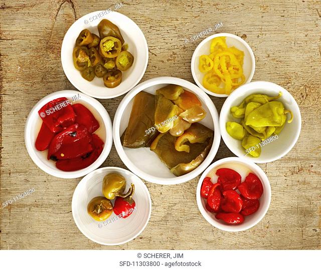 Pickled peppers in white bowls