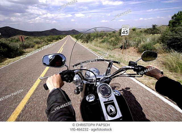 USA, Texas. Motorcyclist, Motorbiker on Harley-Davidson on Highway through Texas. - Big Bend Nationalpark, Texas, USA, 15/10/2006