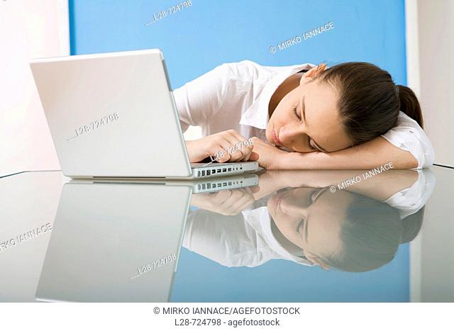 business sleeping in front of laptop
