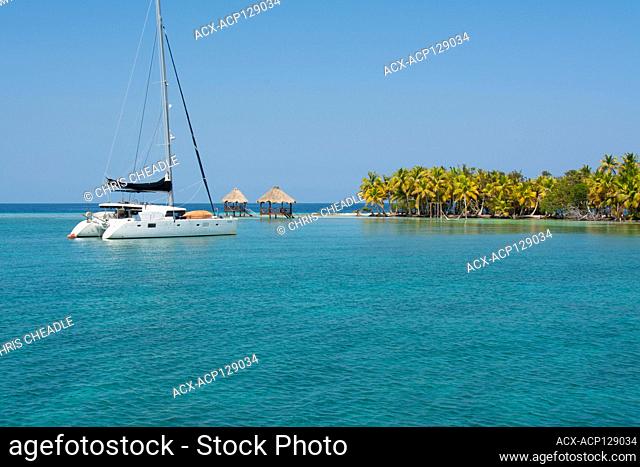 Cruising catamaran at North Long Coco Plum Caye, Belize