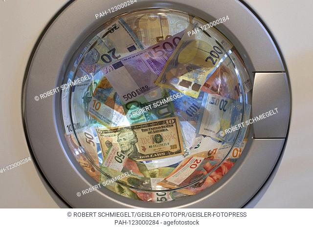 EURO, Swiss Franc and Dollar banknotes in a washing machine | usage worldwide. - Cologne/Nordrhein-Westfalen/Deutschland