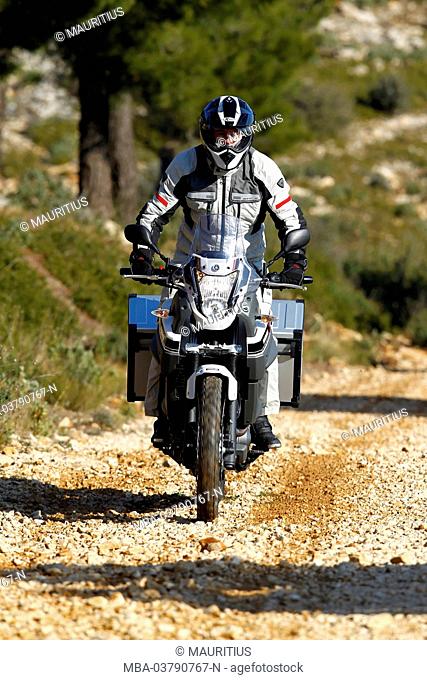 Motorcycle, single cylinder engine Enduro, Yamaha Tenere on gravel road, Southern France, year of construction in 2012