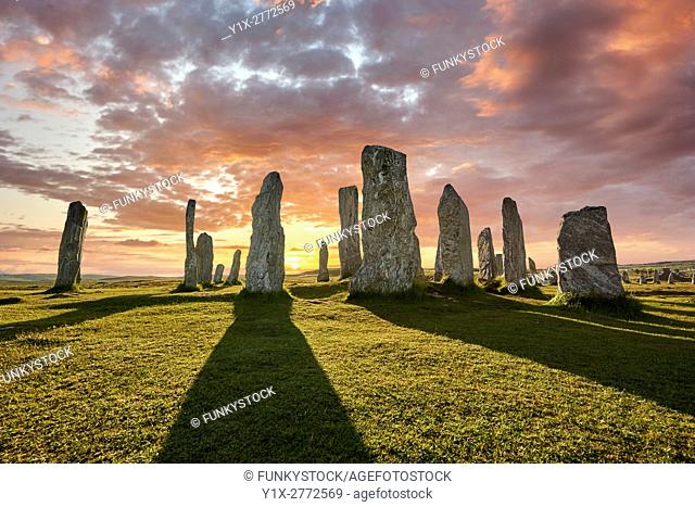 Calanais Standing Stones central stone circle, at sunset, erected between 2900-2600BC measuring 11 metres wide. At the centre of the ring stands a huge monolith...