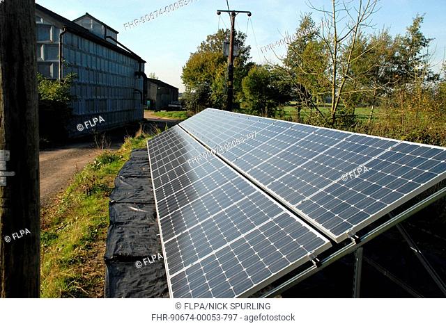 Solar panels, installed to supply electricity power to farm buildings and equipment, Hertfordshire, England, november