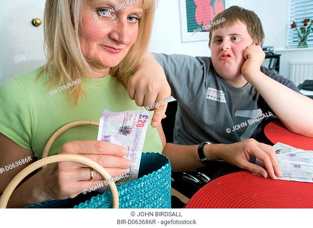 Care home worker taking money off boy with Down's Syndrome