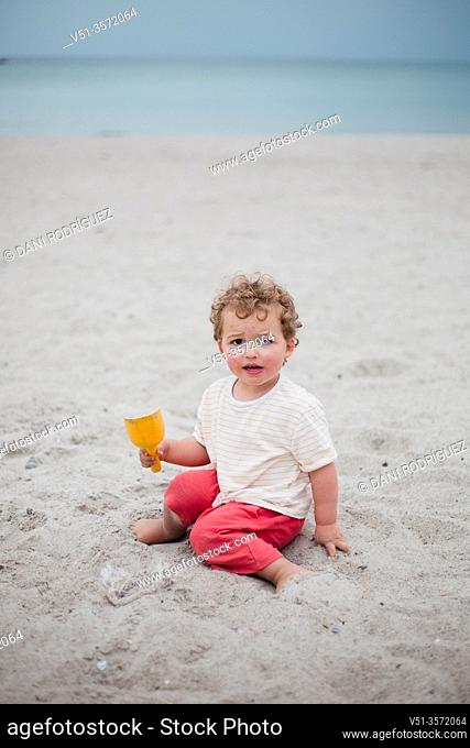 2 years old boy playing at the Beach in the Baltic Sea