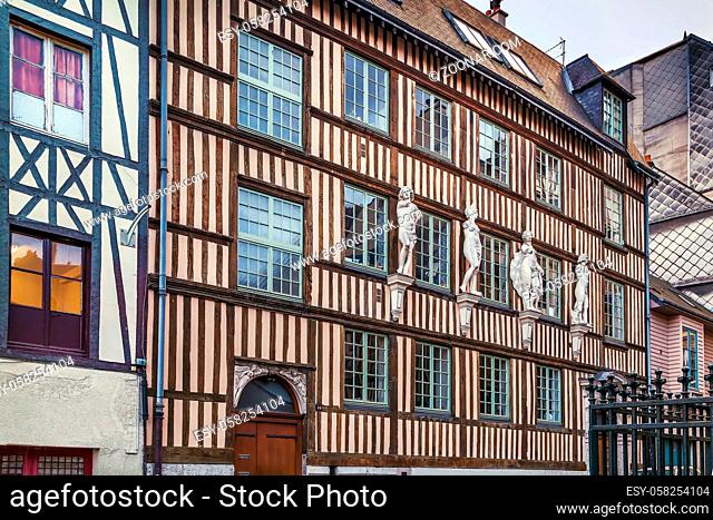 Historical half-timbered house with sculpture in Rouen, France
