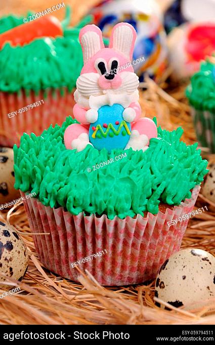 Muffin decorated Easter bunny sitting on the grass