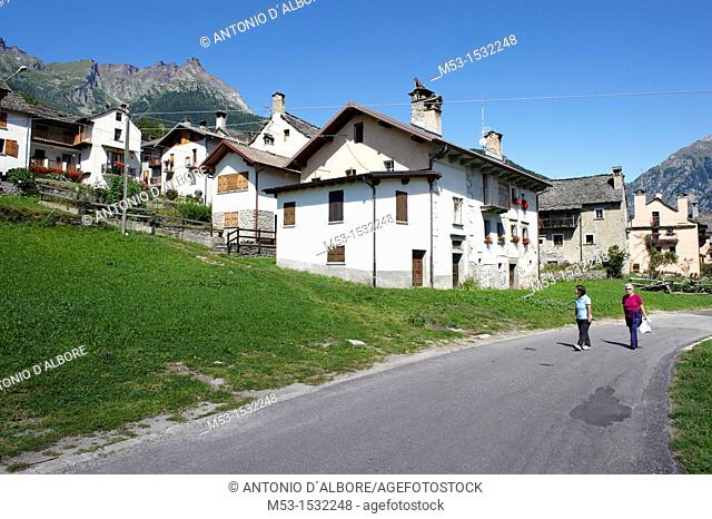 Two woman walk on a road in Viceno di Crodo, a small alpine village in Verbano-Cusio-Ossola Province  Viceno di Crodo  Italy