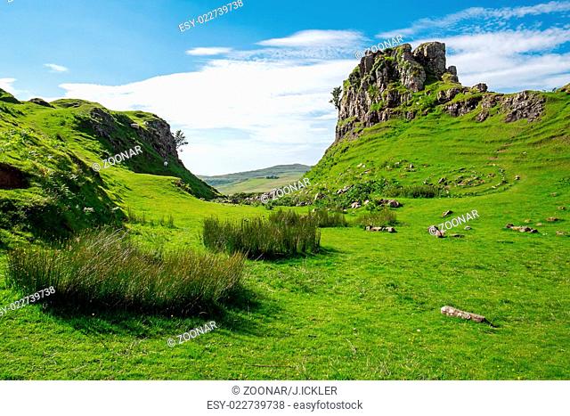 The green Fairy Glen on the Isle of Skye in Scotla