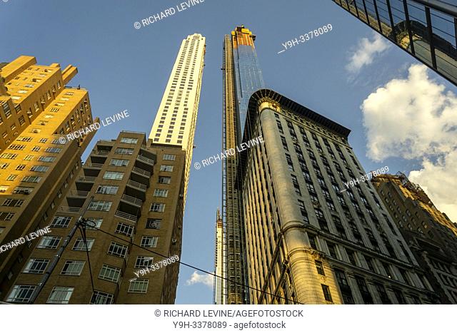 The Extell development, Central Park Tower, right, with other towers, rises above surrounding buildings on West 57th Street