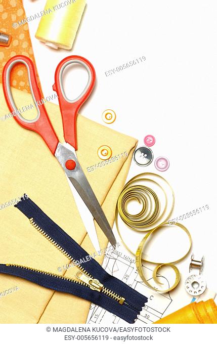Sewing items on white background with copy space