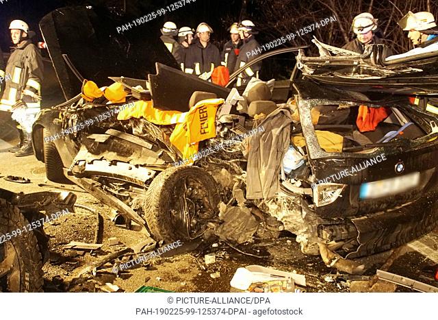 24 February 2019, Baden-Wuerttemberg, Bad Wildbad: There is a wrecked car at the scene of the accident on the Bundesstraße 294 near Bad Wildbad (district of...