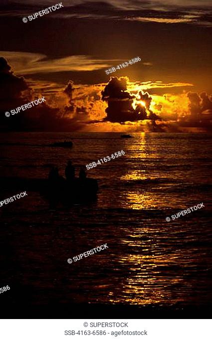 SEYCHELLES, ASSUMPTION ISLAND, ZODIACS IN SUNSET