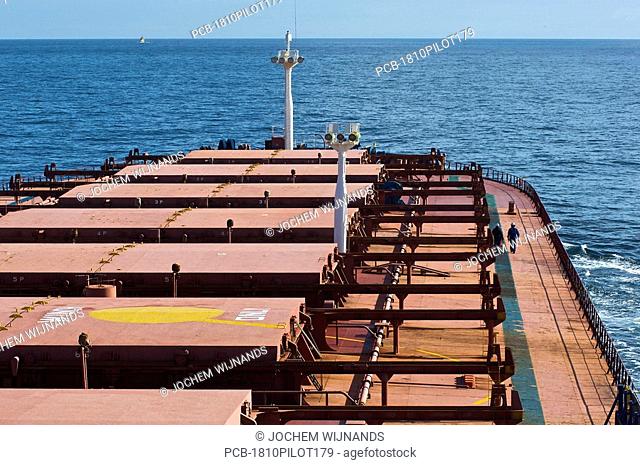 Crew working on the deck of a bulk carrier