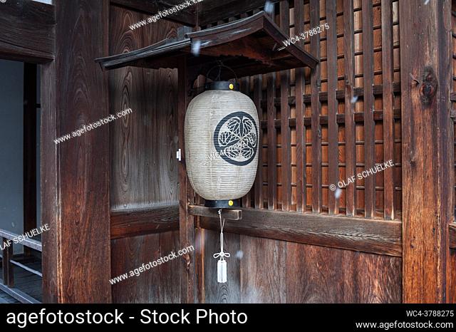 Takayama, Gifu, Japan, Asia - Traditional paper lantern hangs outside at the entrance of a building in the old city