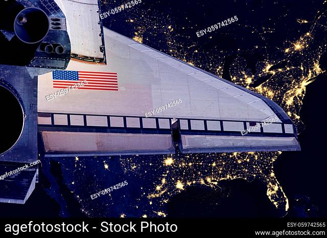 Space Shuttle and aerial night view of the U.S.A. Elements of this image furnished by NASA