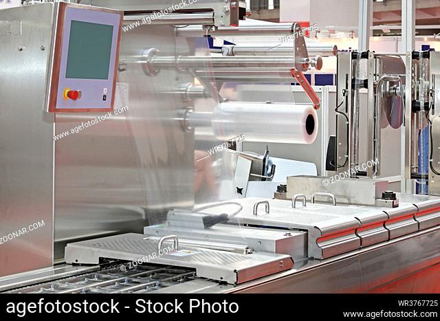 Foil Packing Machine at Production Line in Food Factory