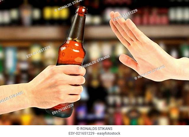 hand reject a bottle of beer in the bar