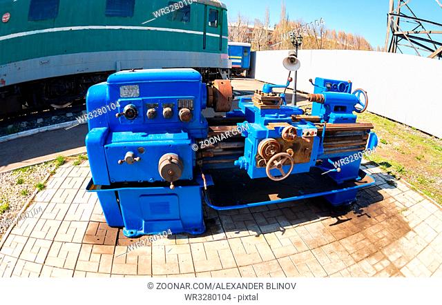 Samara, Russia - April 30, 2017: An obsolete rusted lathe machine. Fisheye view