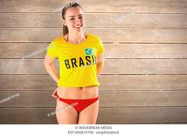 Composite image of pretty girl in bikini and brasil tshirt