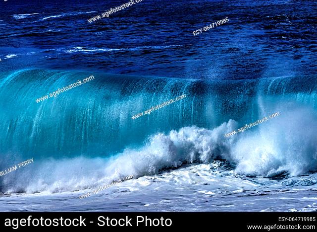 Watching Large Wave Waimea Bay North Shore Oahu Hawaii. Waimea Bay is famous for big wave surfing. On this day, waves were 15 to 20 feet high