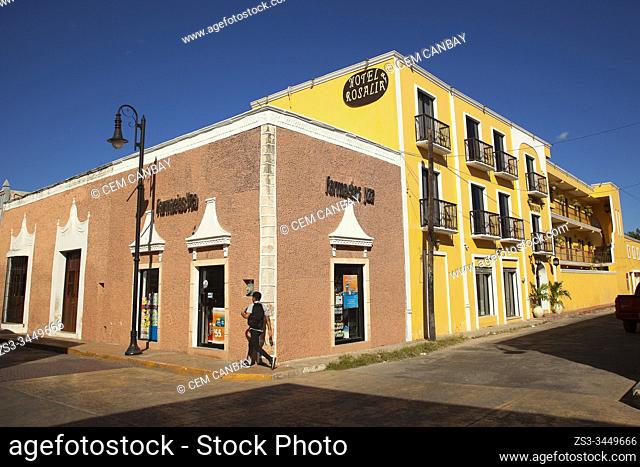 Young man in front of the colonial buildings at the city center, Valladolid, Yucatan Province, Mexico, Central America