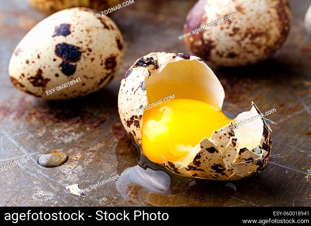 close up broken eggs with yellow yolk