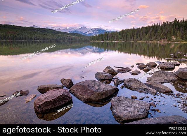 Sunrise on a beautiful reflective lake in the Canadian Rockies, Jasper National Park, UNESCO World Heritage Site, Alberta, Canada, North America