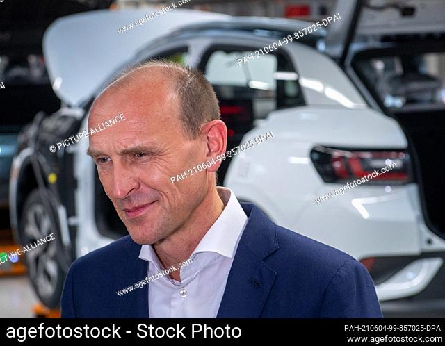 03 June 2021, Saxony, Zwickau: Ralf Brandstätter, Member of the Board of Management of the Volkswagen brand, stands at the assembly line for the fully electric...