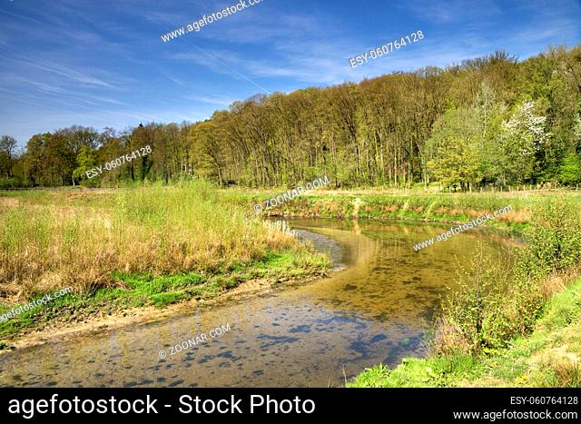 The Geleenbeek in spring atmosphere flowing through the Geleenbeek valley near Schinnen in the Dutch province Limburg