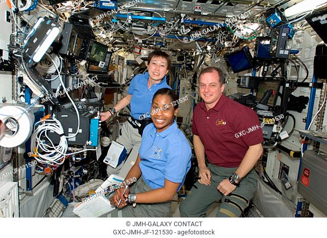 Japan Aerospace Exploration astronaut Naoko Yamazaki (left) joins NASA astronauts Stephanie Wilson and T.J. Creamer in the busy Destiny laboratory aboard the...