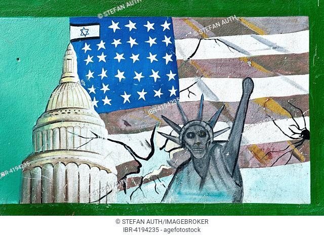 Graffiti on a wall, flag of the United States with Israeli flags, capitol building, Statue of Liberty with a skull face, former Embassy of the United States of...