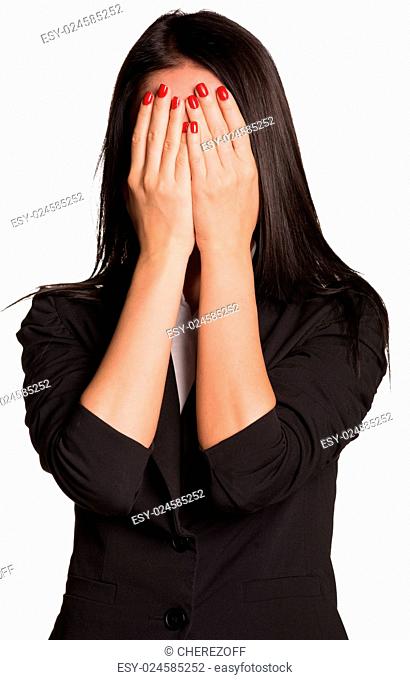 Beautiful businesswomen in suit covered her face with her hands. Isolated on white background